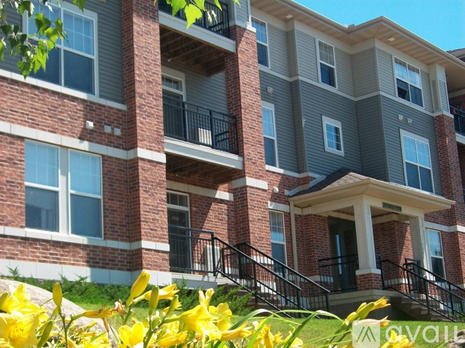 A building with a balcony and a front door.