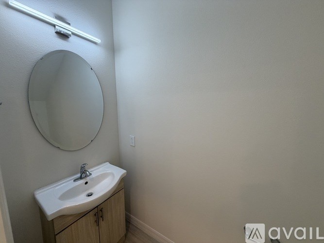 A bathroom with a sink and mirror.