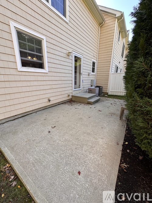 A house with a white door and a window.