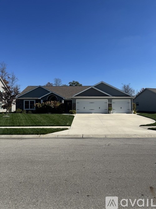 A house with a garage is available for sale.