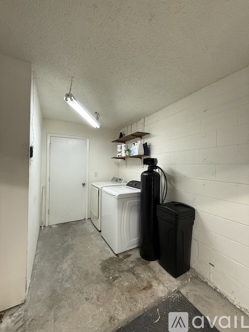 A laundry room with a washer and dryer.