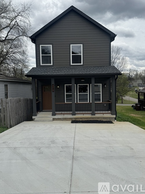 A two-story house with a front porch.