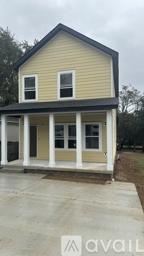 A two-story house with a front porch.