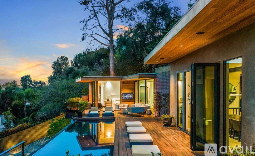 A modern house with a pool in the backyard.