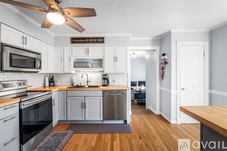 A kitchen with a sign that says "If you can cook, we will cook."