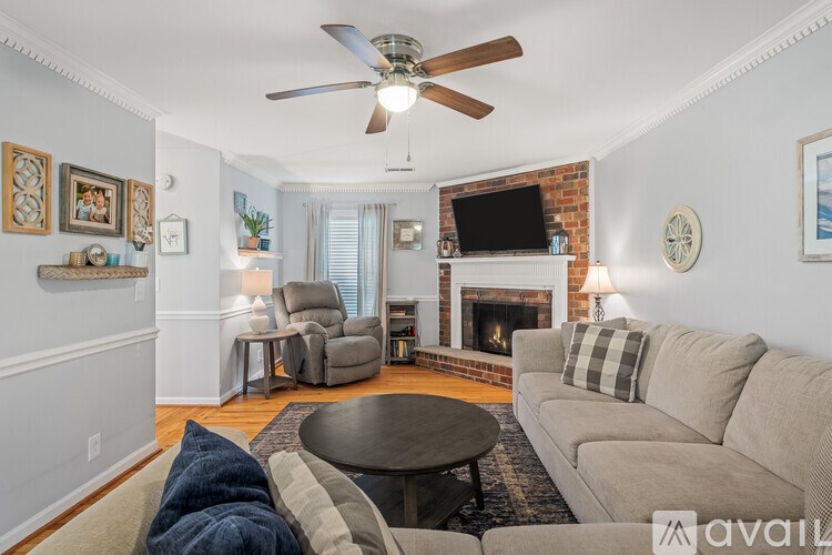A living room with a fireplace and a couch.