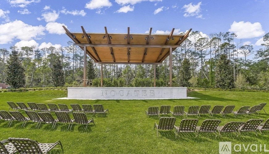 A large outdoor seating area with a canopy and chairs is available for events.