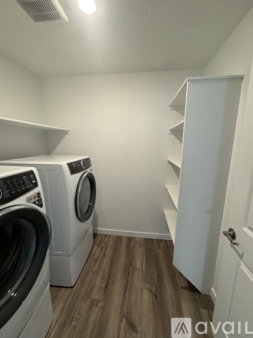 A laundry room with a washer and dryer.