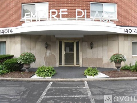 The front of a building with the name "EMPIRE PLACE" on it.