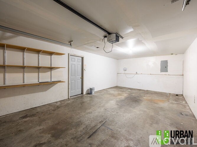 A spacious, empty room with a door and a window.