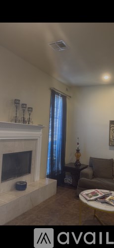 A living room with a fireplace and a couch.