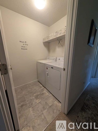 A laundry room with a washer and dryer.