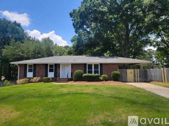 A house with a lawn in front of it is for sale.