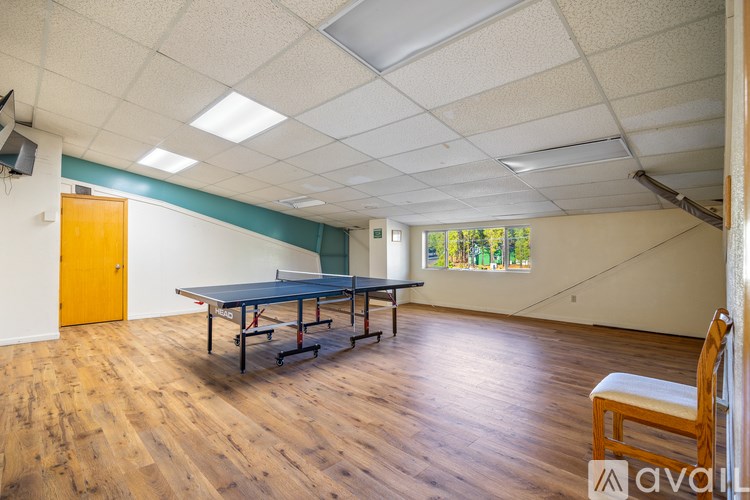 A room with a table and chairs in it.