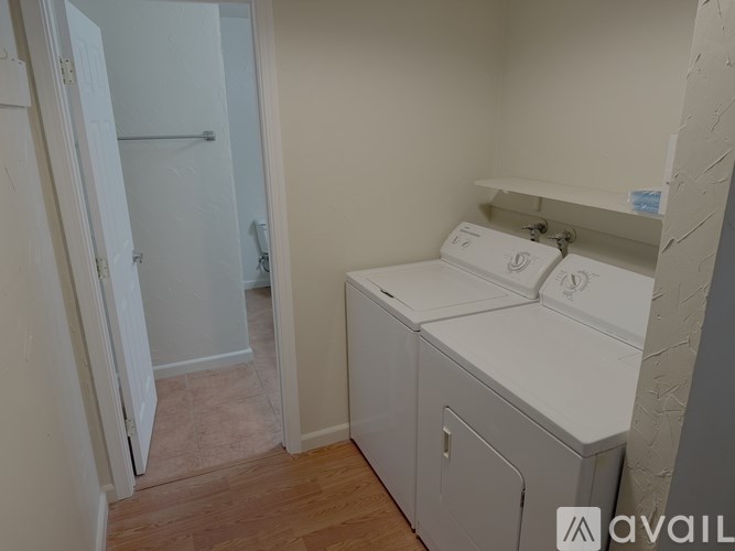 A bathroom with a toilet and sink.