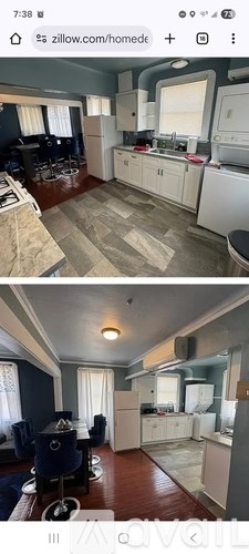 A kitchen with white cabinets and a washing machine.
