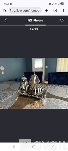 A silver crown-shaped dish is placed on a table.