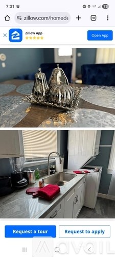 A kitchen with a sink and a red cutting board.