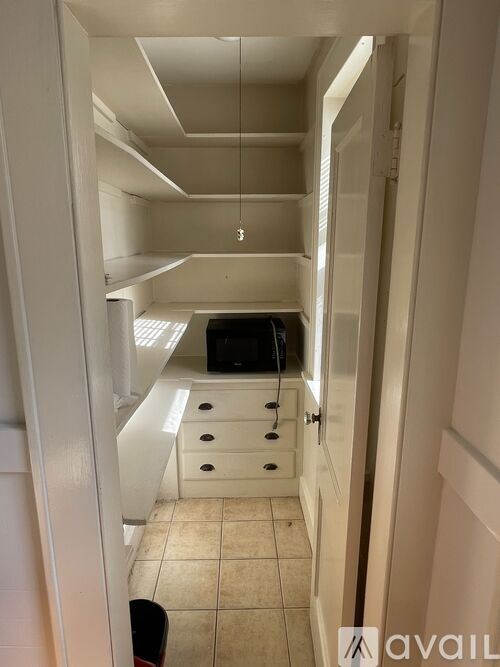A bathroom with a walk-in shower and a toilet.