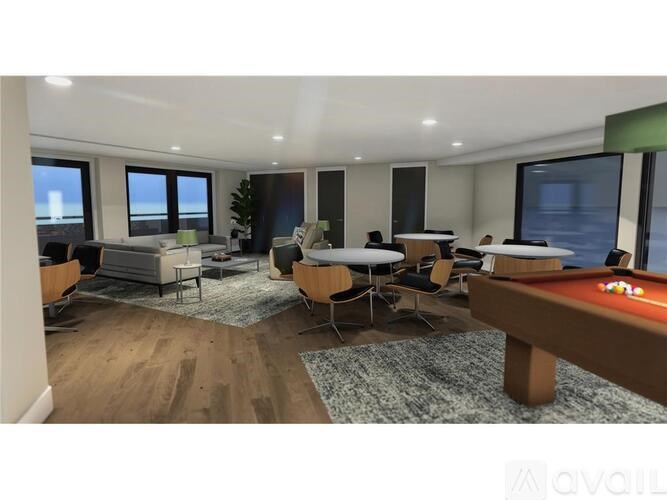 A room with a pool table and a couch.