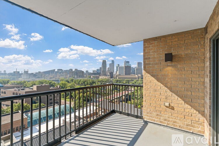 A balcony with a view of a city skyline.