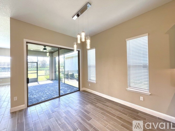 A room with a sliding glass door leading to a patio.