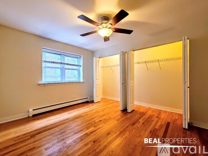 A room with a ceiling fan and wooden flooring is available for rent.