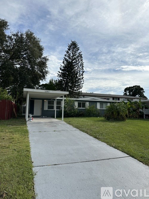 A house with a driveway in front of it.