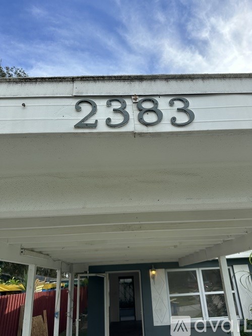A white building with the number 2383 on it.