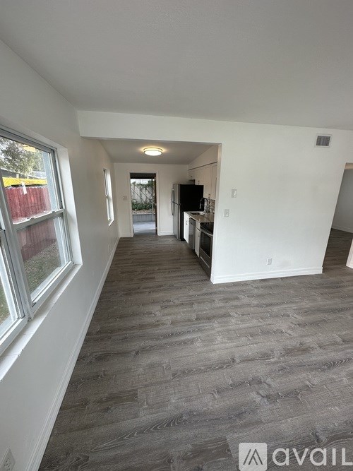 A room with a grey floor and white walls.