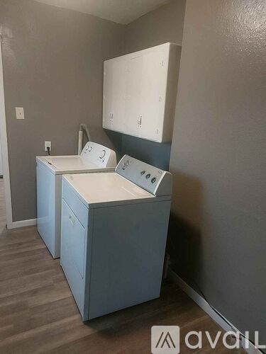 A bathroom with a sink and a cabinet.