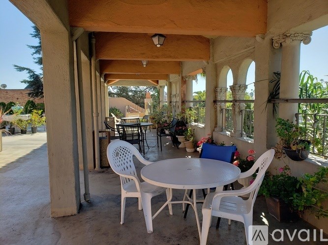 A patio with a table and chairs is available for rent.