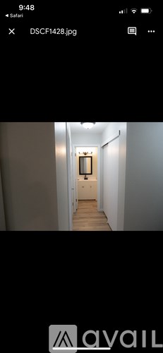 A long hallway with a door at the end.