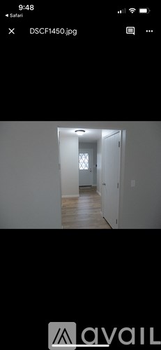 A white doorway leads to another room.