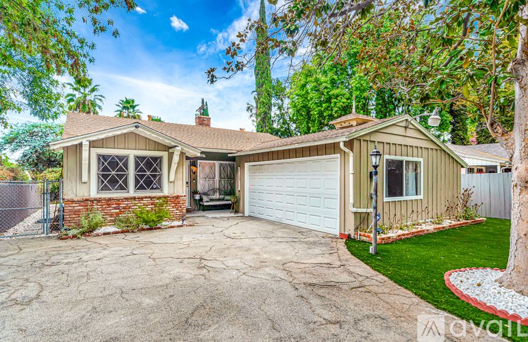 A house with a garage and a driveway.