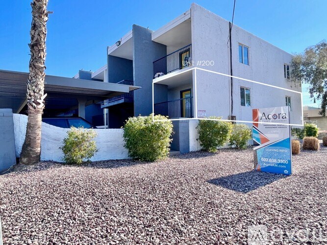 A modern building with a sign that reads "Acora" in front of it.