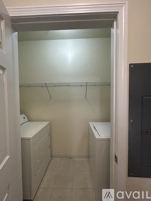 A small, white bathroom with a toilet and sink.