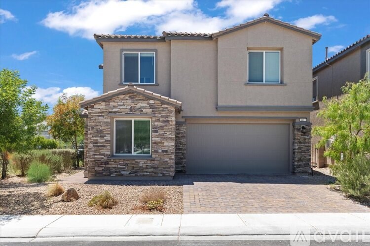A house with a stone pillar in front of it.