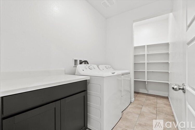 A laundry room with a washer and dryer.