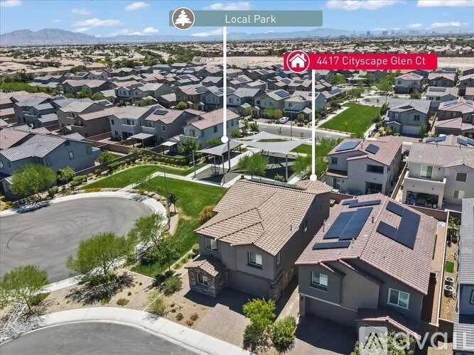 A bird's eye view of a local park and a residential area with houses and a street.