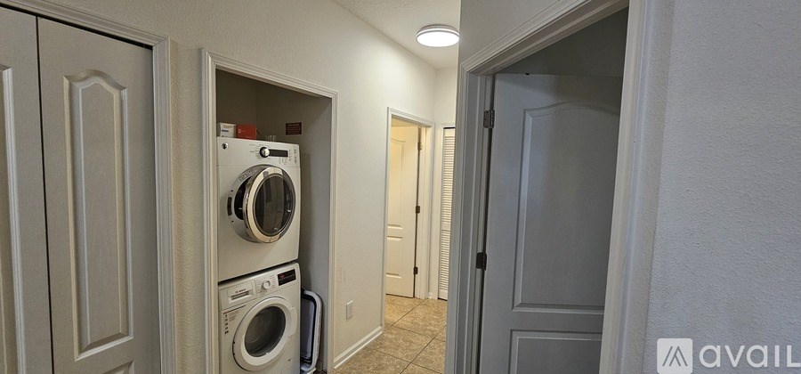 A laundry room with a washer and dryer in it.