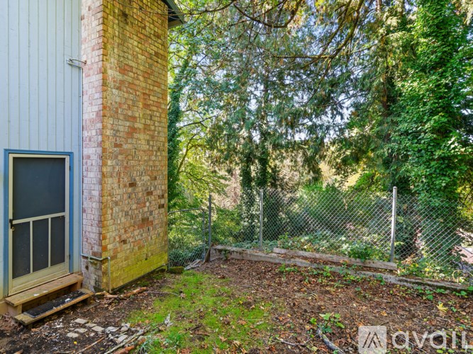 A small window is on the side of a building.