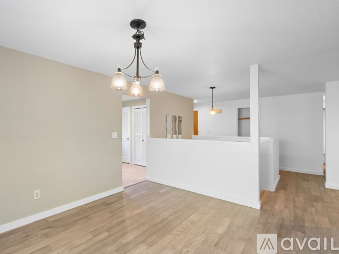 A room with a chandelier and a white reception desk.