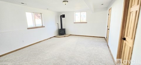 A room with a wood stove in it.