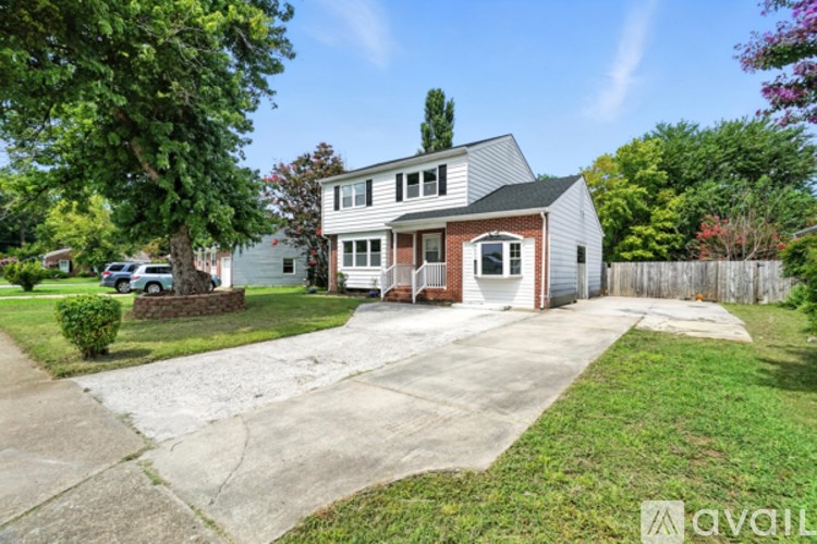 A house with a driveway in front of it.