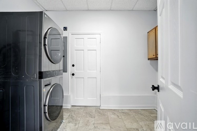 A laundry room with a washer and dryer.