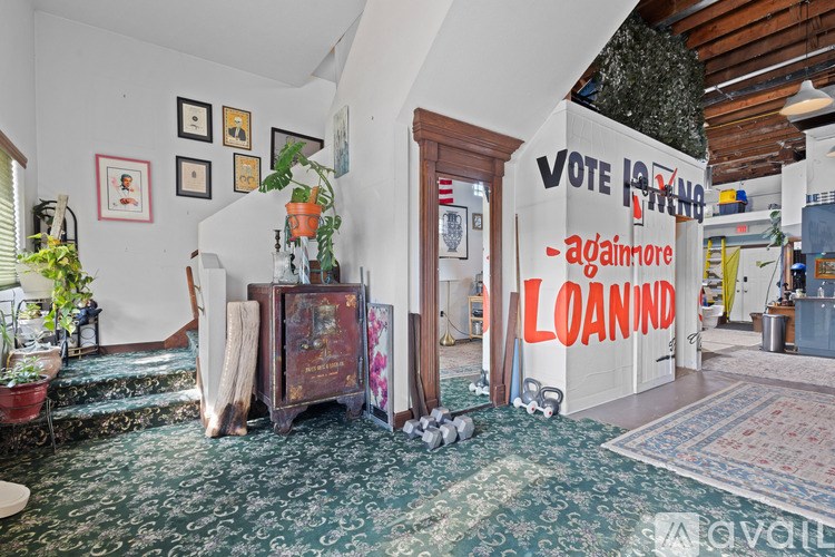 A room with a sign that says "VOTE" and "Againmore LOANIND".
