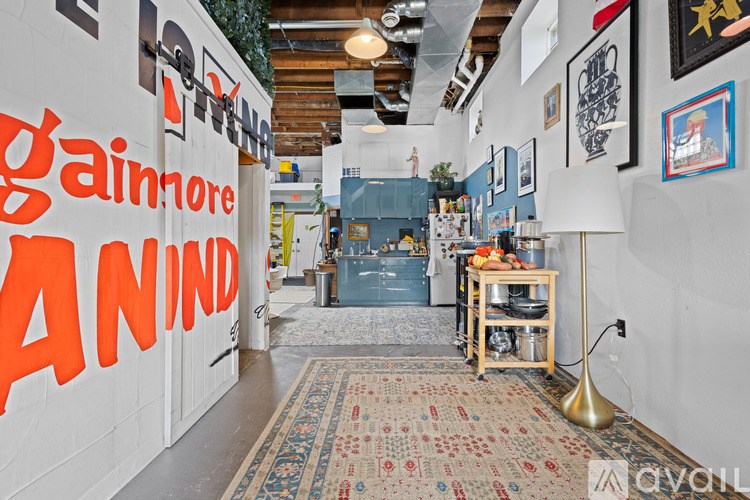 A hallway with a sign that says "gainmore" on the wall.