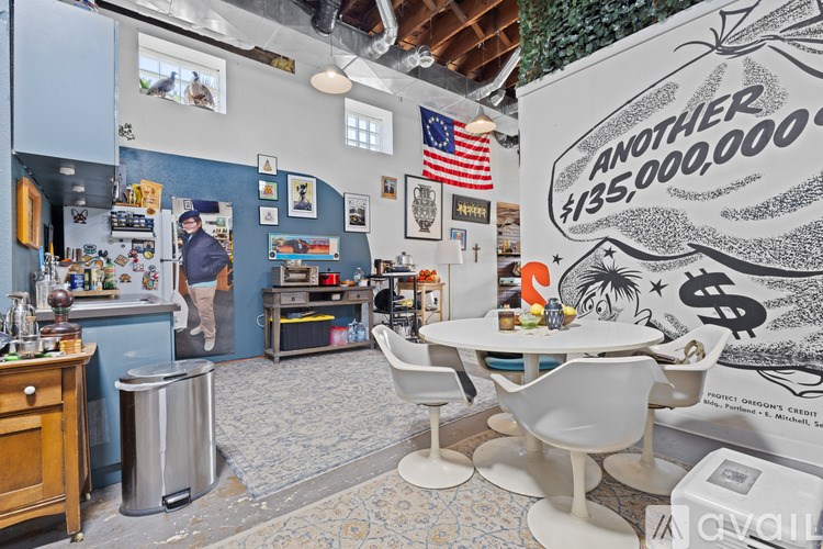 A man is standing in a room with a blue wall and a poster that says "ANOTHER #135,000,000".