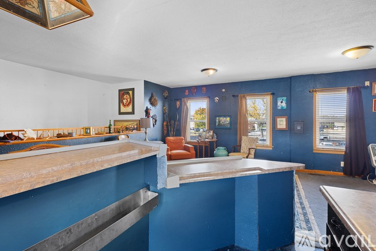 A room with blue walls and a counter.